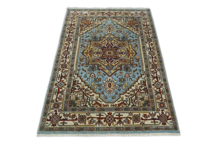 Sera blue and ivory rug with a central medallion and intricate floral border