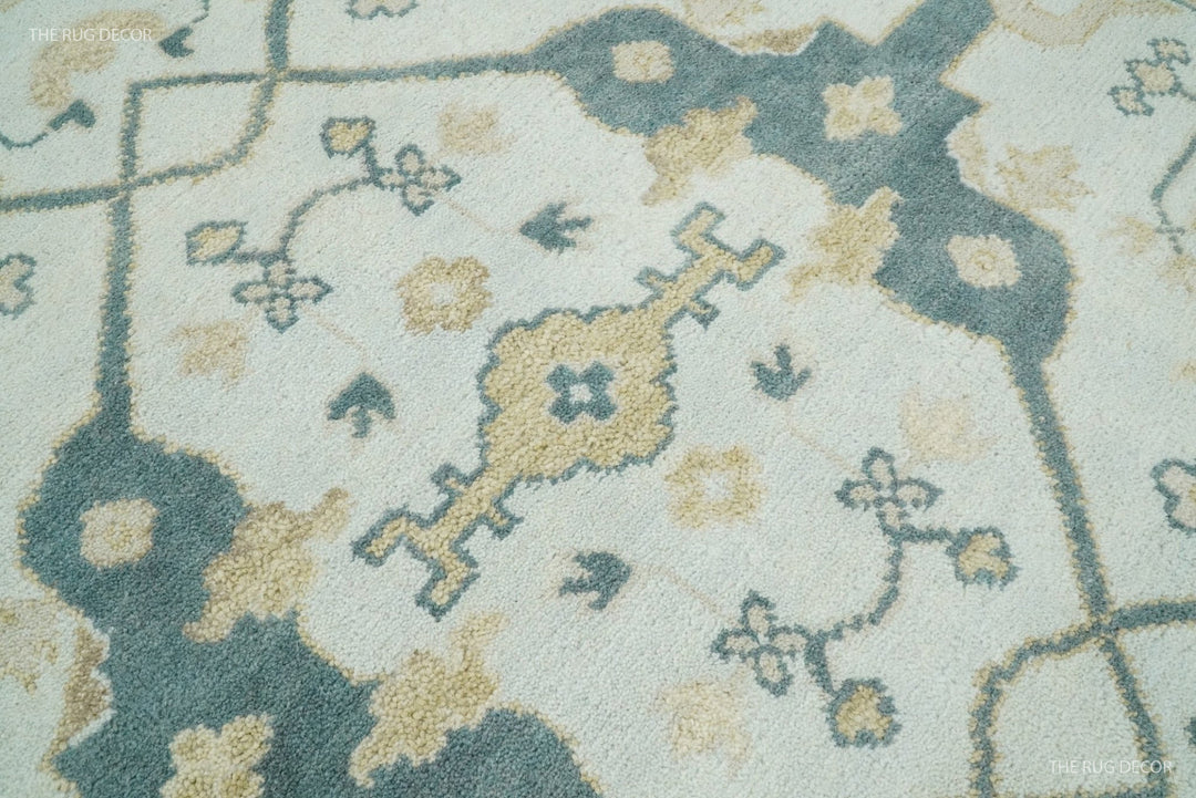Teal and ivory Oushak wool rug close-up of floral and geometric motifs