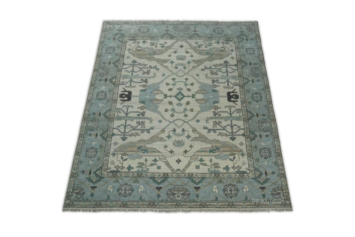 Full view of the rectangular Oushak rug with central medallion and floral border