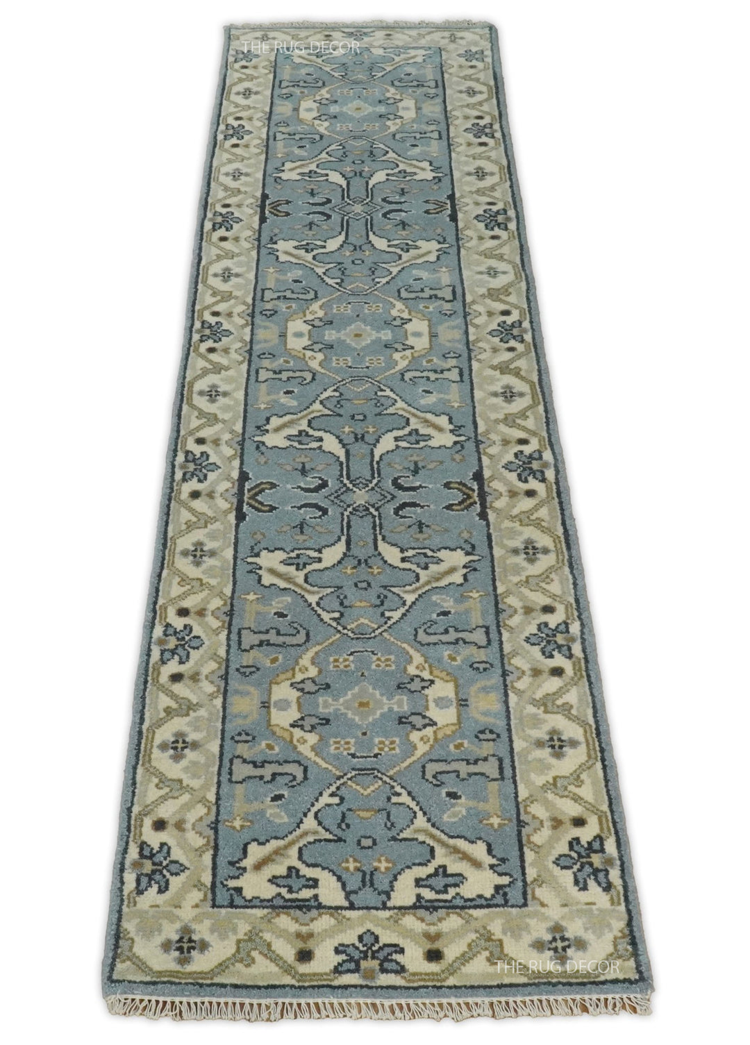 Blue-gray floral runner rug with beige borders, shown lengthwise