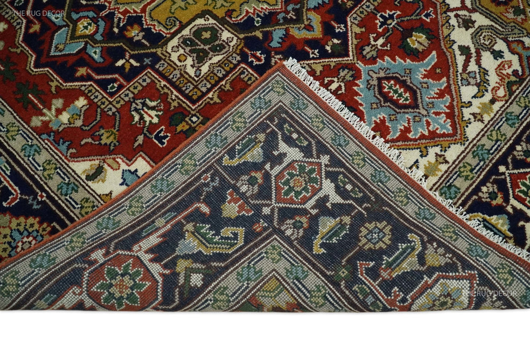 Rust and blue traditional Heriz Serapi area rug close-up of geometric motifs and teal accents
