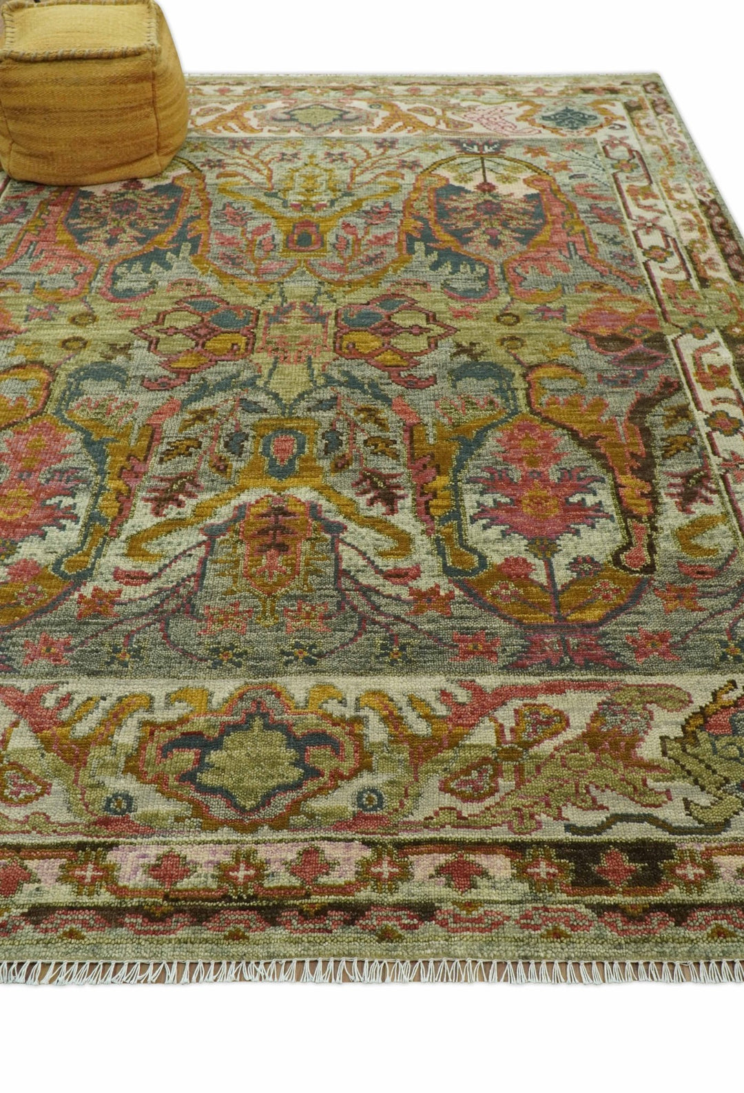 Hand-knotted wool rug corner with multicolor motifs and short fringed border