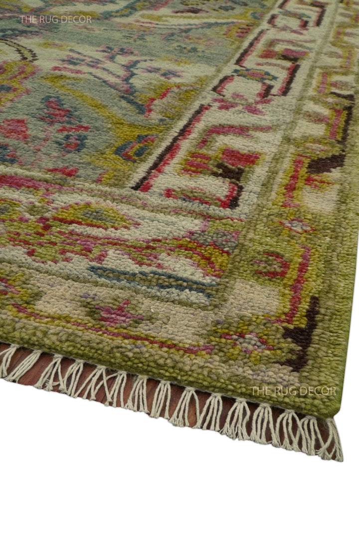 Runner rug corner with a patterned border and cream fringe