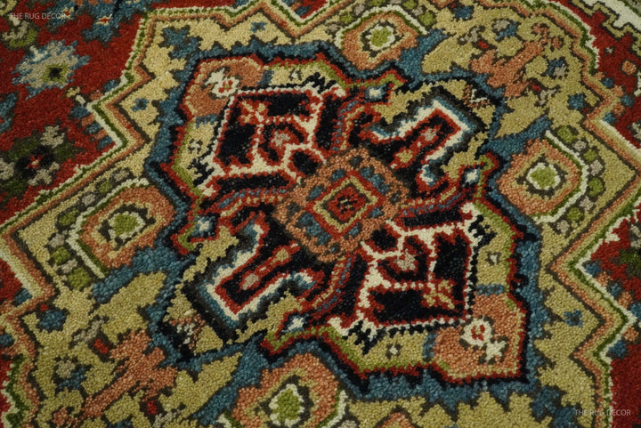 Serapi rug pattern close-up with ornate medallion in rust, navy, teal and olive