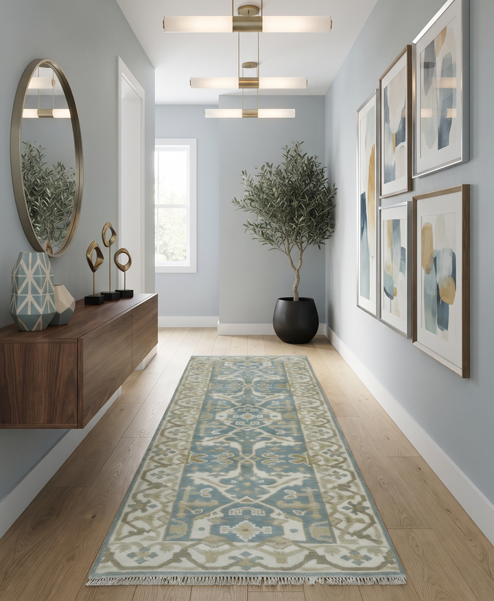 Teal and ivory Oushak wool runner rug displayed in a hallway