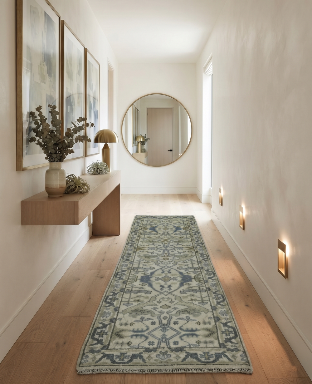 Ivory and blue patterned wool runner laid out in a hallway