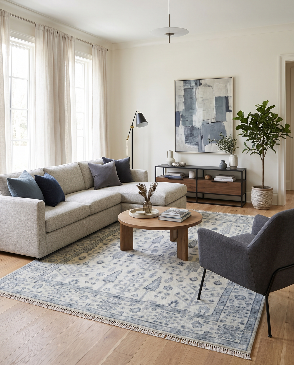 Light blue patterned wool rug with medallion motifs and decorative border