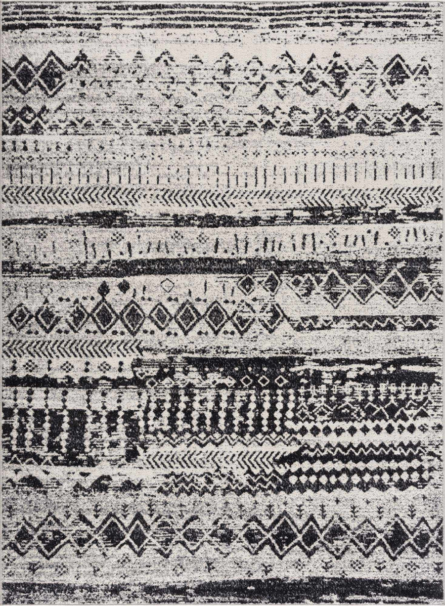 Washable area rug with ivory-and-black geometric stripe and diamond pattern