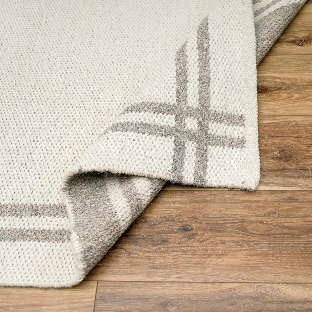 Nimue Ivory Modern Style Hand Woven Wool Area Rug
