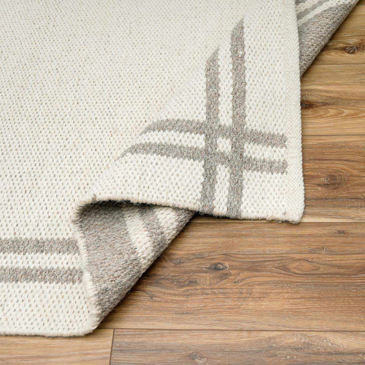 Nimue Ivory Modern Style Hand Woven Wool Area Rug