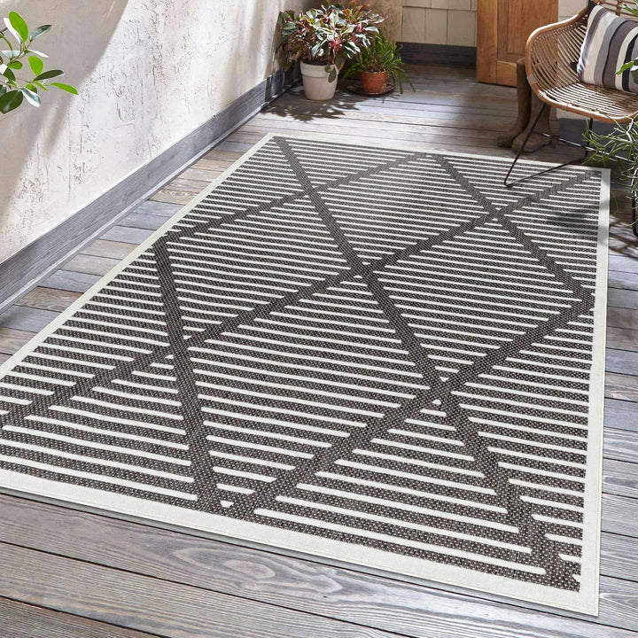 Anah Geometrical Black And Ivory Outdoor Rug