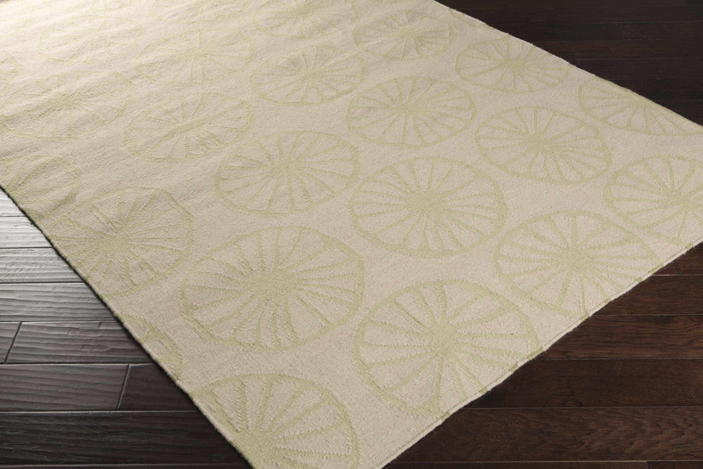 Beige circular-pattern wool area rug shown from an angled view