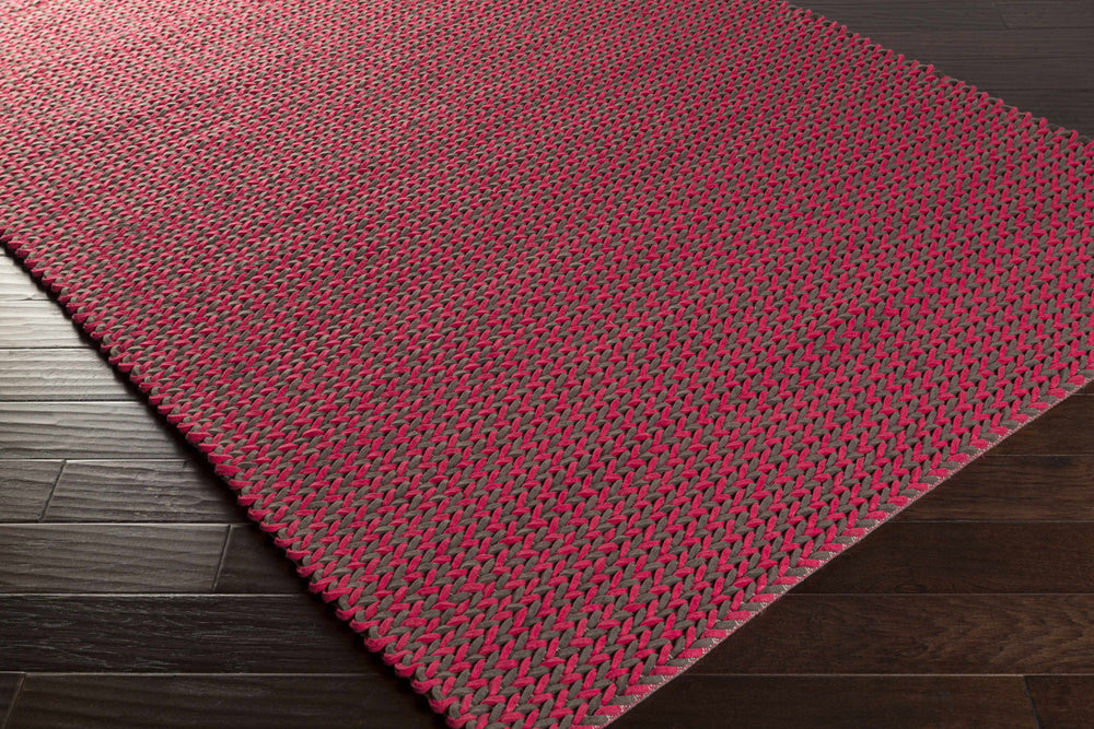 Red hand-woven area rug, rectangular, visible edge and textured weave detail