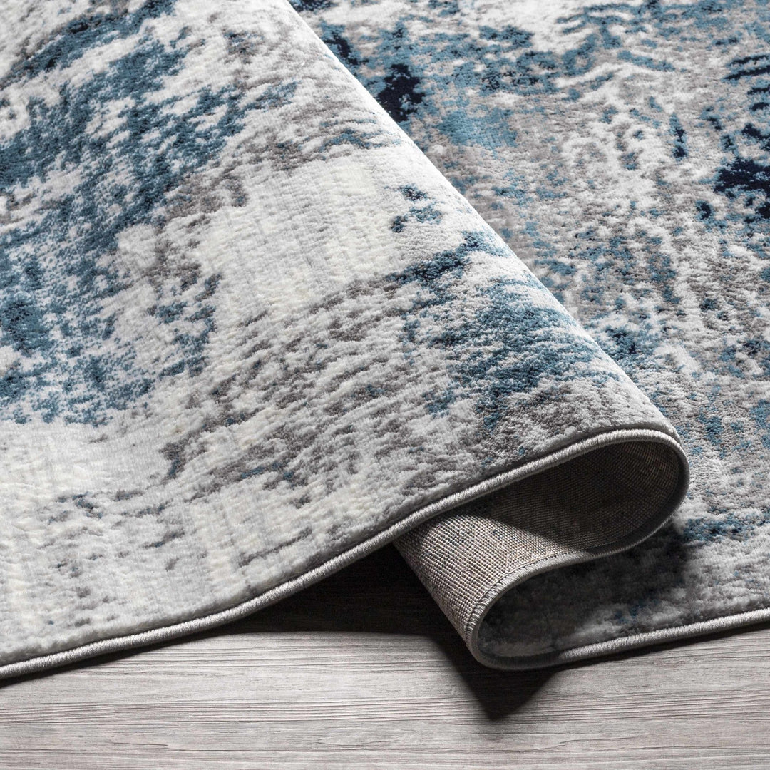 Baldwyn Blue And Ivory Modern Abstract Design Area Rug - The Rug Decor