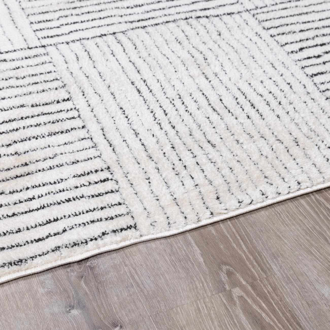 Basira Geometrical Ivory And Black Machine Woven Rug - The Rug Decor