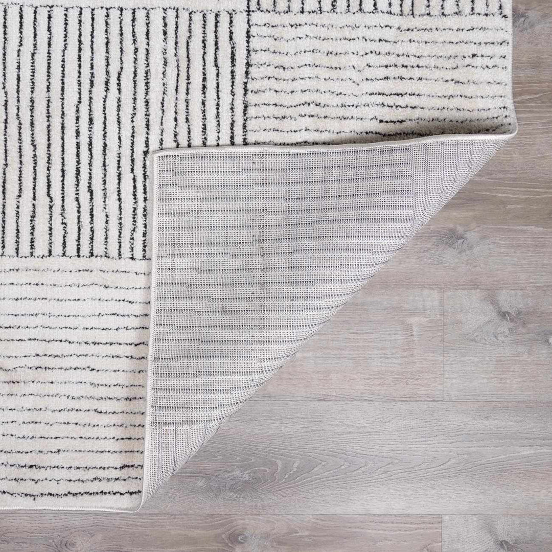 Basira Geometrical Ivory And Black Machine Woven Rug - The Rug Decor