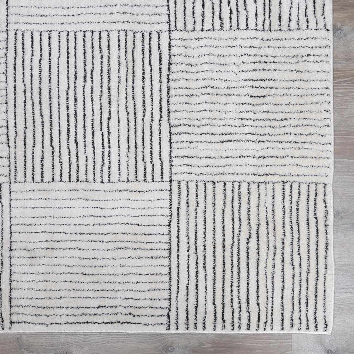 Basira Geometrical Ivory And Black Machine Woven Rug - The Rug Decor