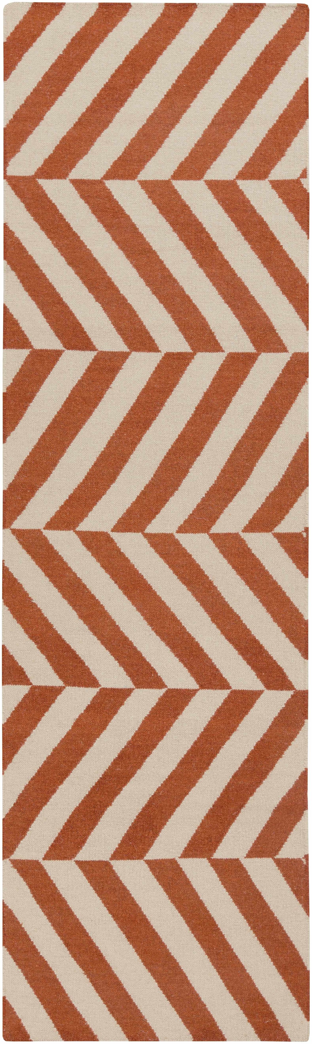 Orange and cream chevron area rug with repeating geometric blocks