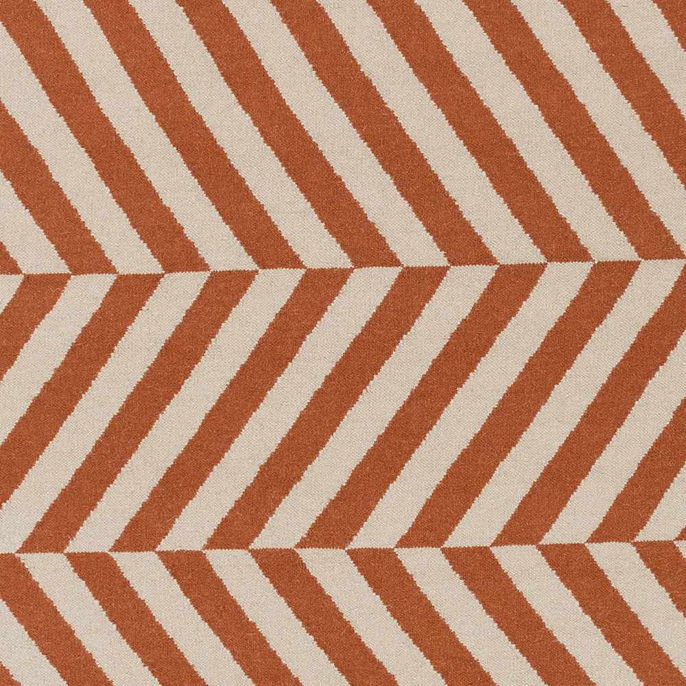 Close-up of orange and cream chevron stripe area rug pattern