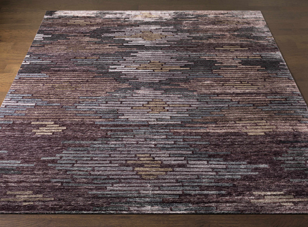 Charcoal and purple abstract area rug with horizontal brick-like pattern and border.