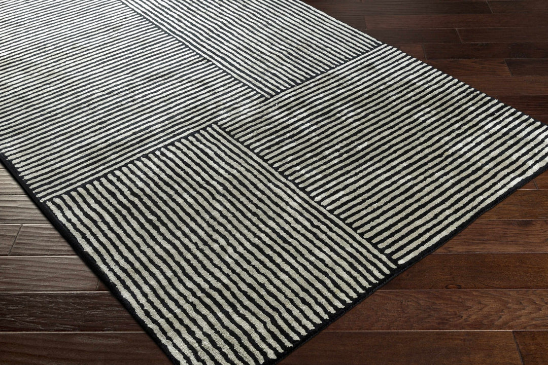 Chittering Modern Style Black And Ivory Hand Tufted Area Rug - The Rug Decor