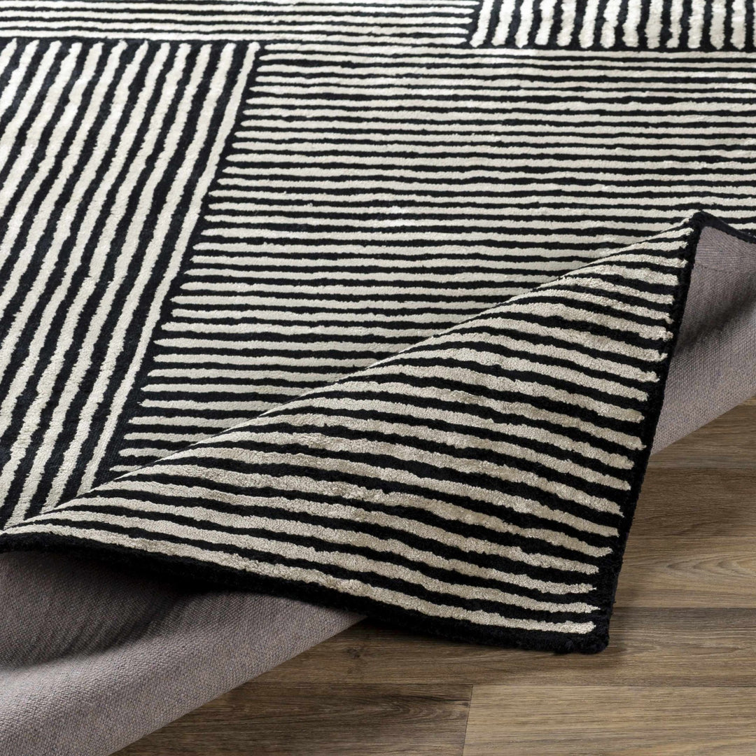 Chittering Modern Style Black And Ivory Hand Tufted Area Rug - The Rug Decor