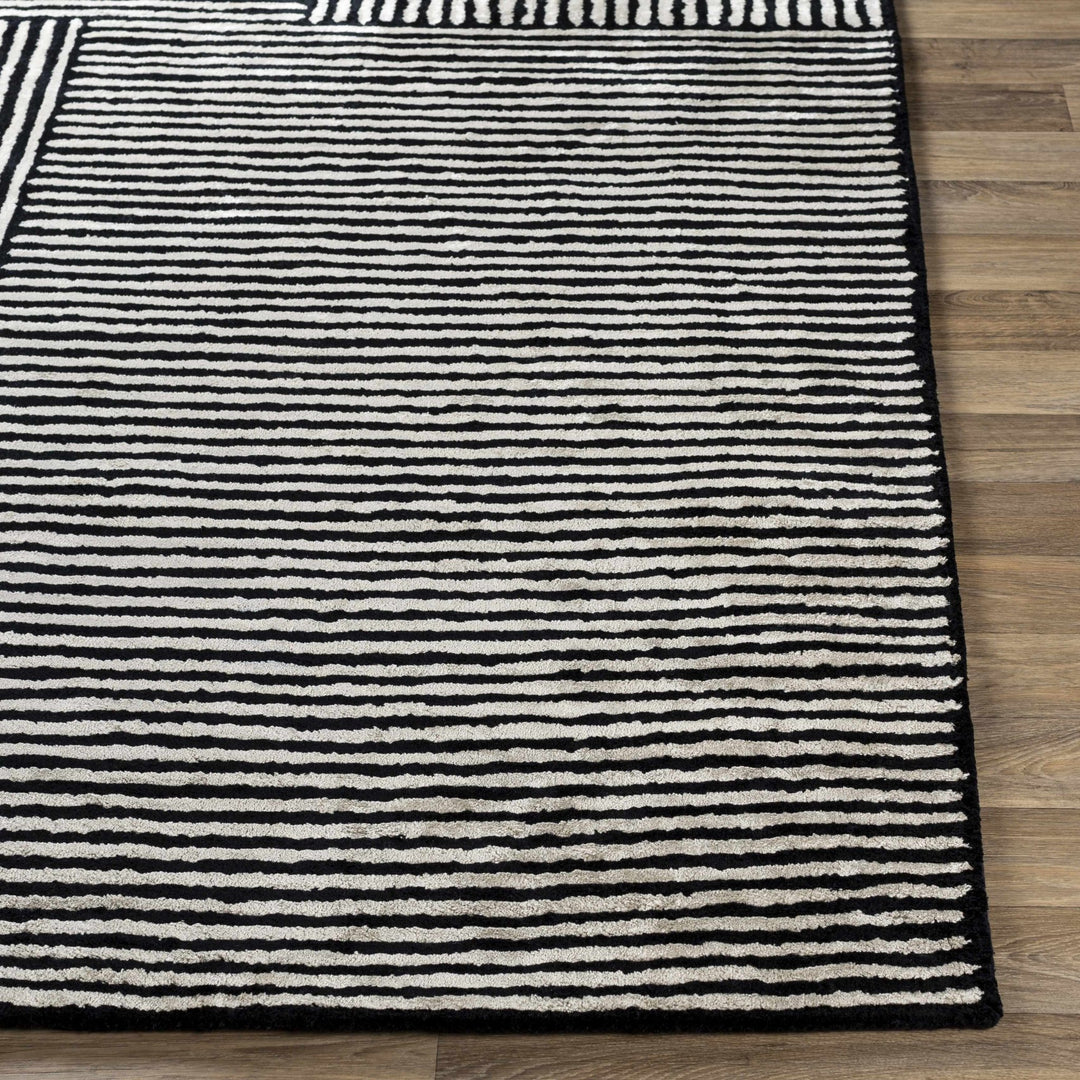 Chittering Modern Style Black And Ivory Hand Tufted Area Rug - The Rug Decor