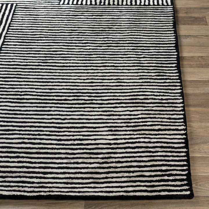 Chittering Modern Style Black And Ivory Hand Tufted Area Rug - The Rug Decor