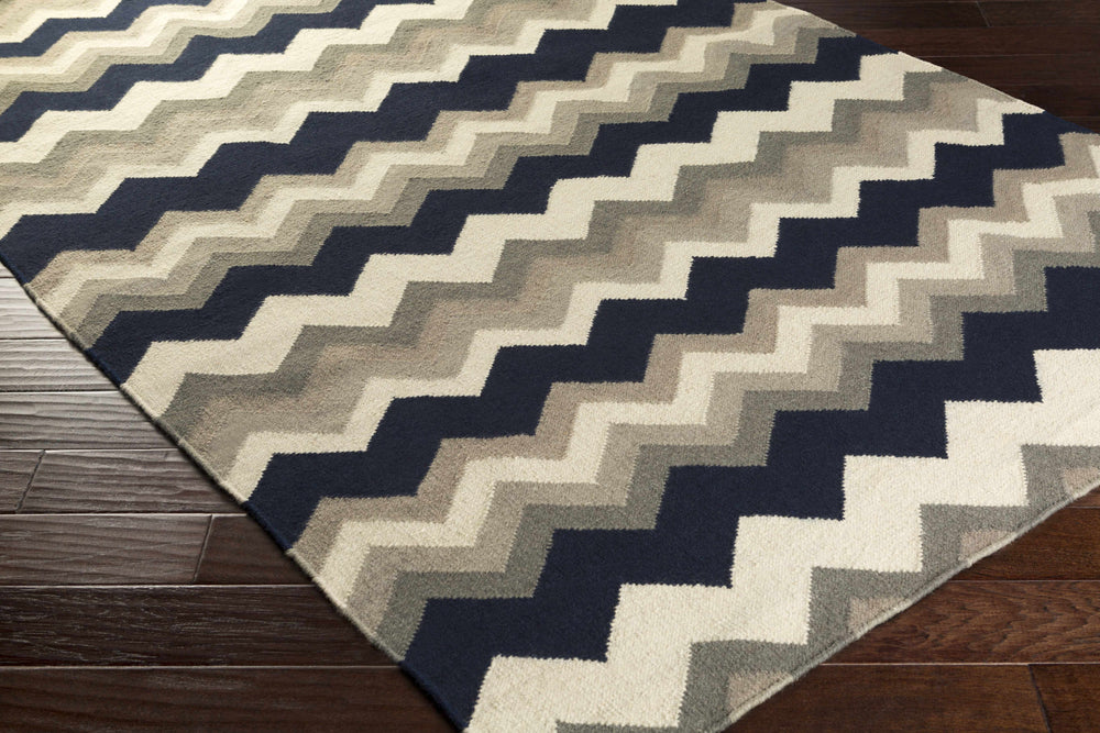 Chevron zigzag wool area rug in navy and cream with gray tones