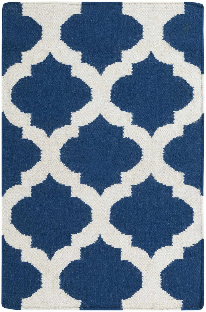 Blue and ivory geometric area rug with flat border and repeating quatrefoil shapes
