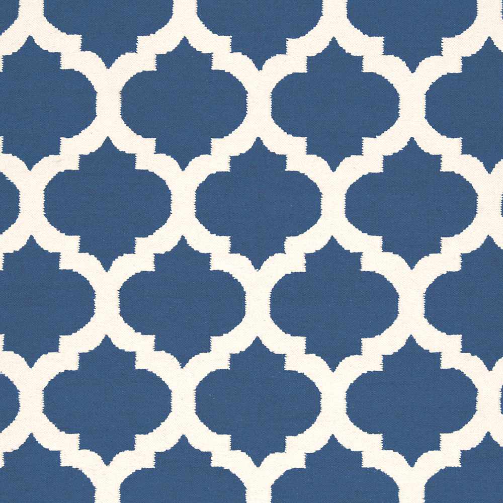 Close-up of blue and ivory geometric star-and-clover rug pattern