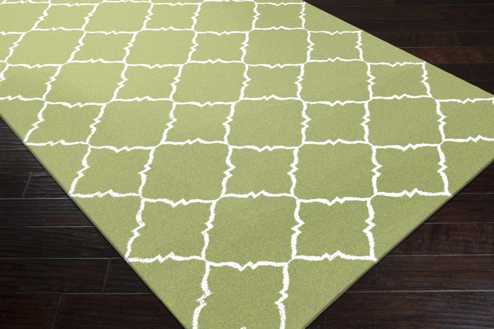 Green geometric hand-woven area rug with white quatrefoil lattice border