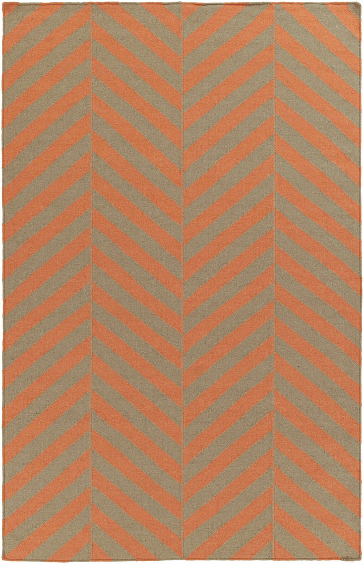 Hand-woven area rug with orange and brown chevron zigzag pattern on cream background