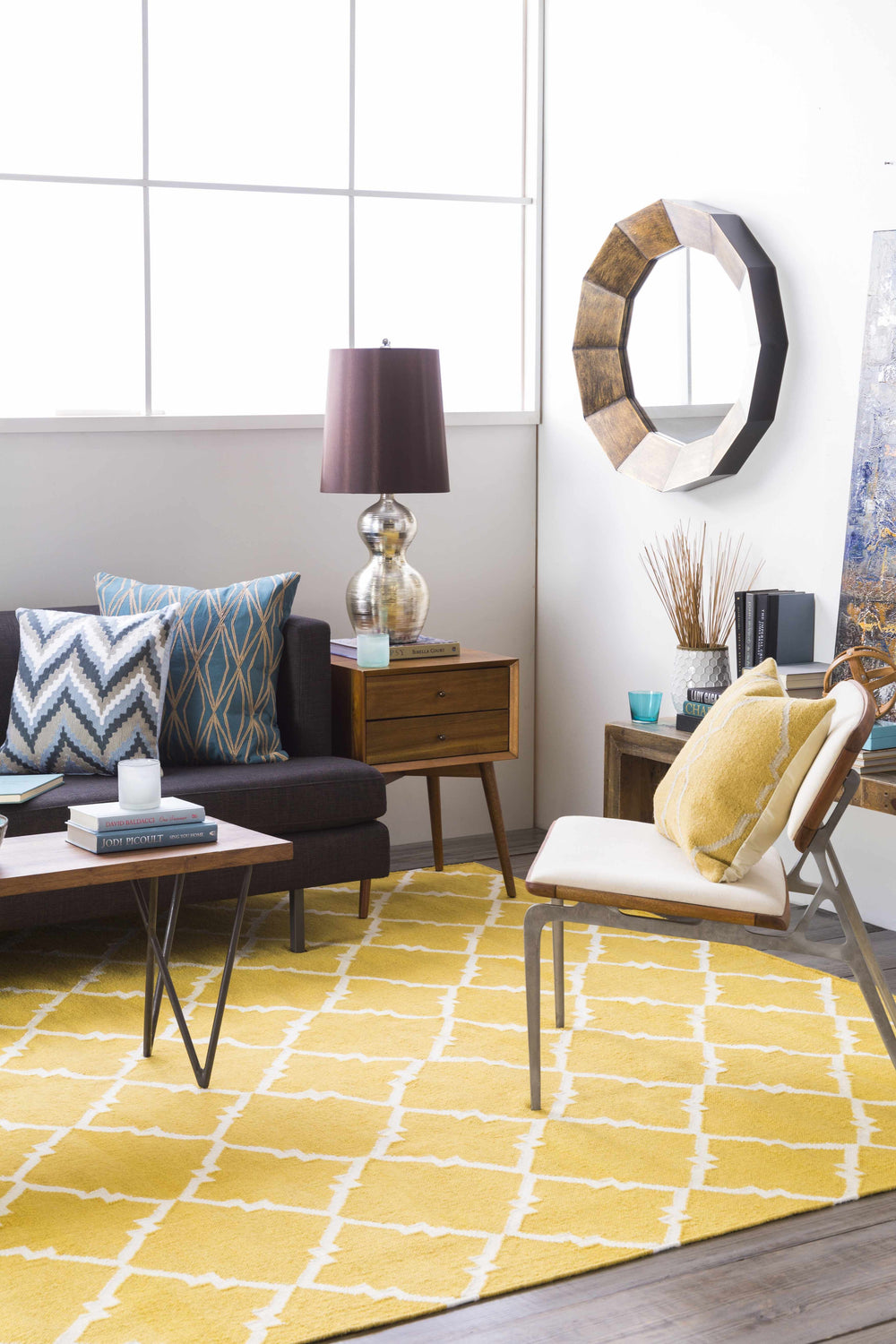 Mustard and gray geometric circular pattern area rug on hardwood floor