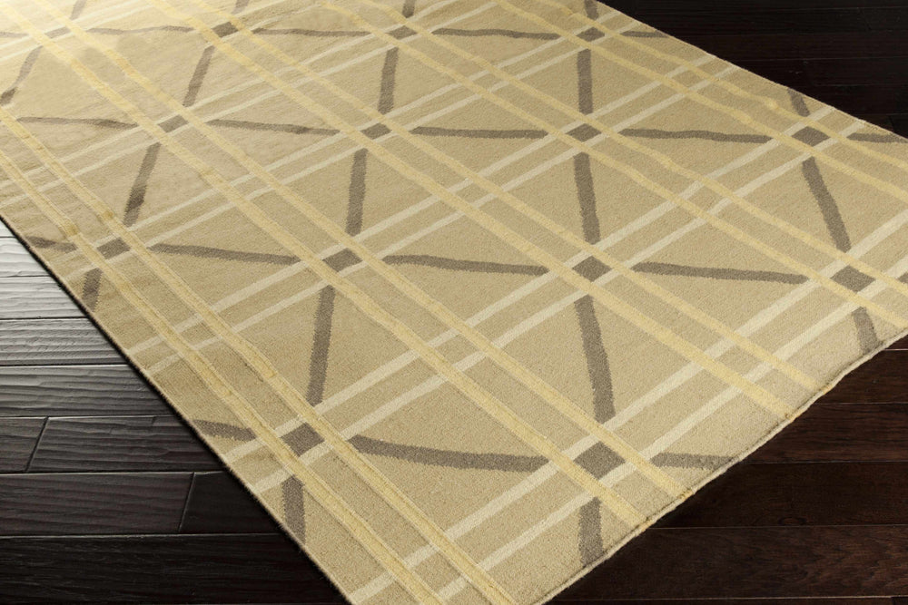 Beige hand-woven area rug with large geometric X and grid pattern, corner view