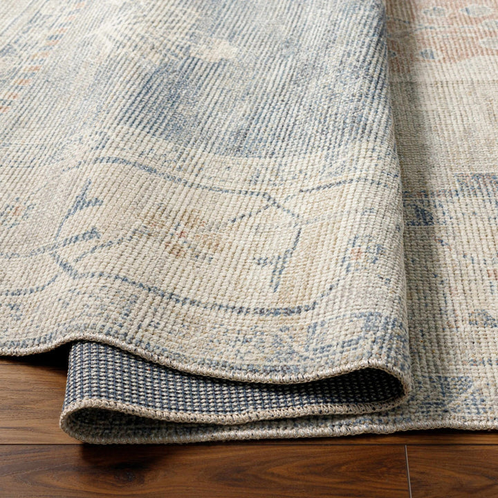 Gyan Traditional Blue And Ivory Machine Woven Area Rug - The Rug Decor