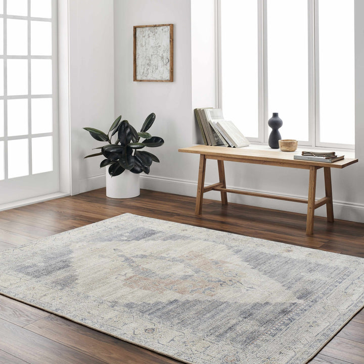 Gyan Traditional Blue And Ivory Machine Woven Area Rug - The Rug Decor