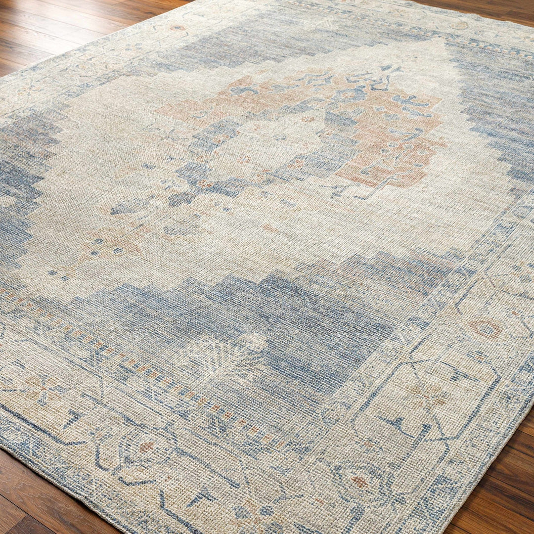 Gyan Traditional Blue And Ivory Machine Woven Area Rug - The Rug Decor