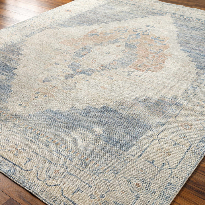 Gyan Traditional Blue And Ivory Machine Woven Area Rug - The Rug Decor