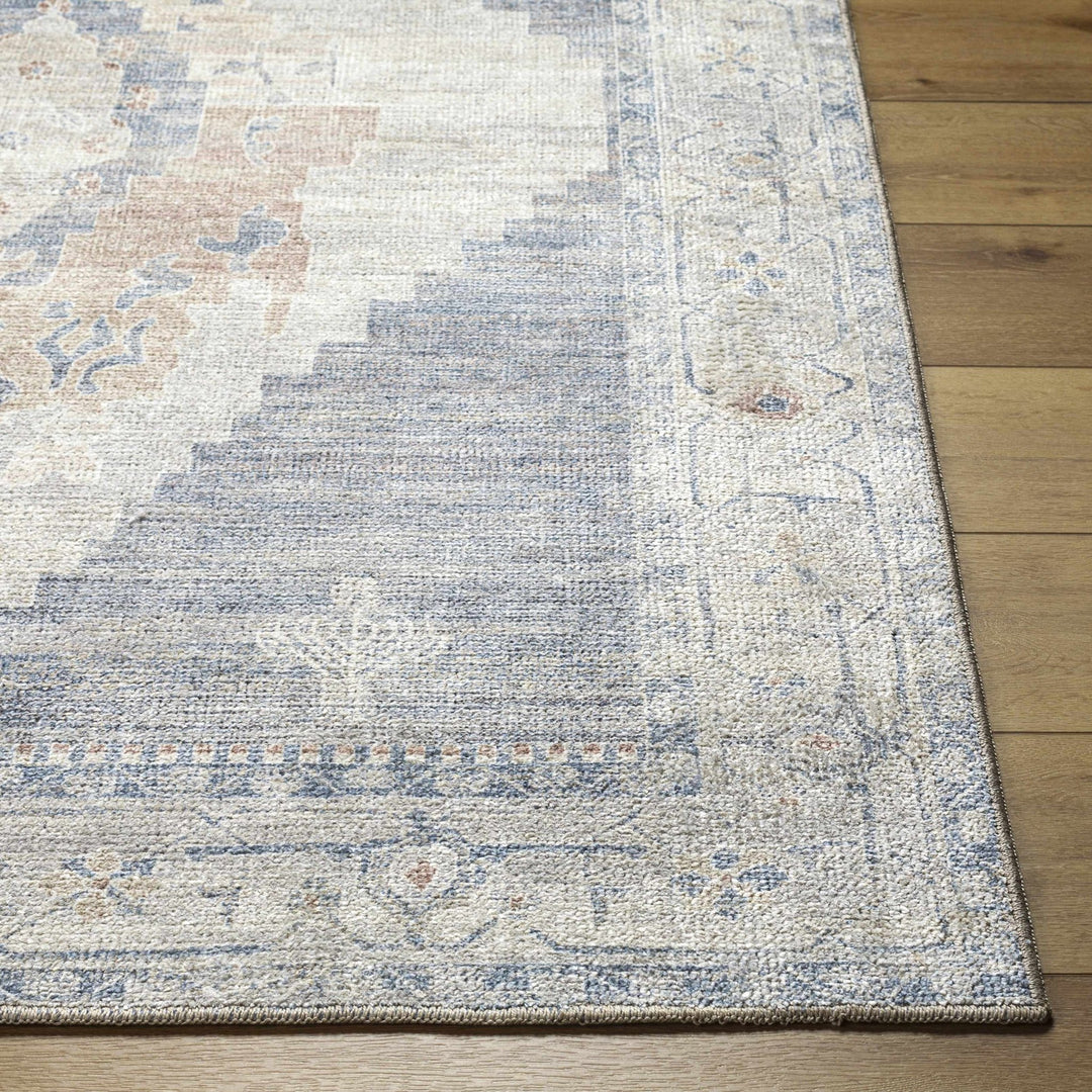 Gyan Traditional Blue And Ivory Machine Woven Area Rug - The Rug Decor