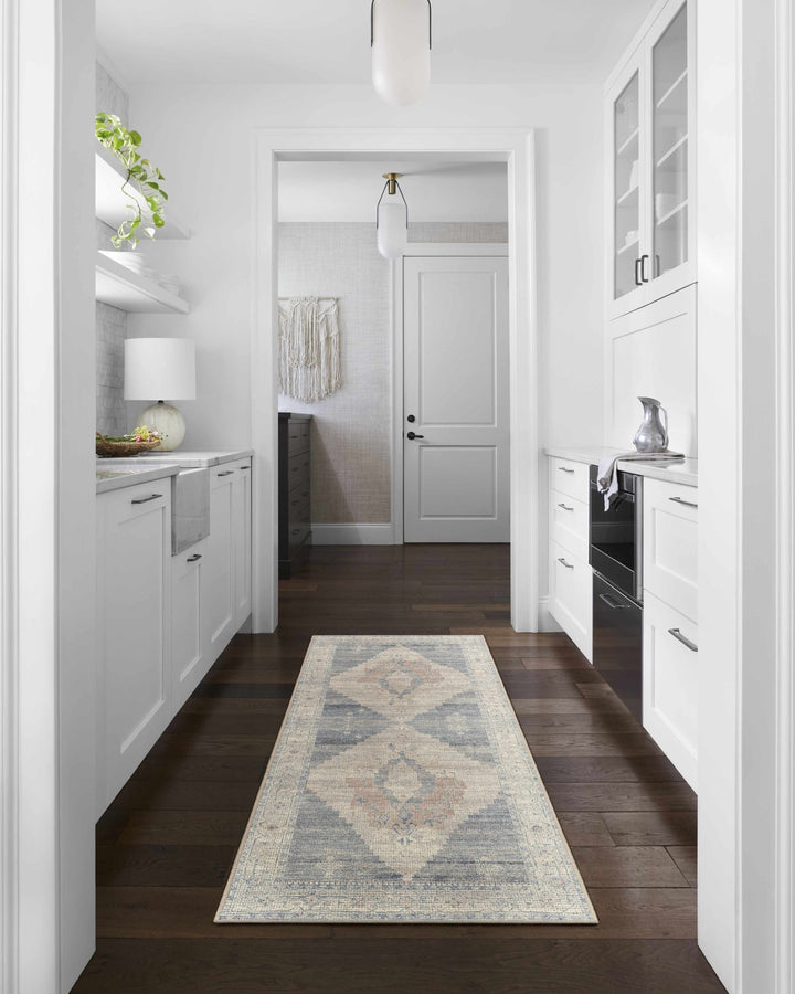 Gyan Traditional Blue And Ivory Machine Woven Area Rug - The Rug Decor