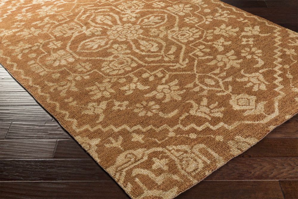 Brown and tan geometric medallion hand-knotted wool area rug, corner view