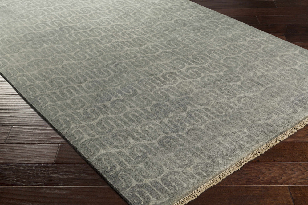 Gray geometric wool rug corner view with border, rectangular hand-knotted look