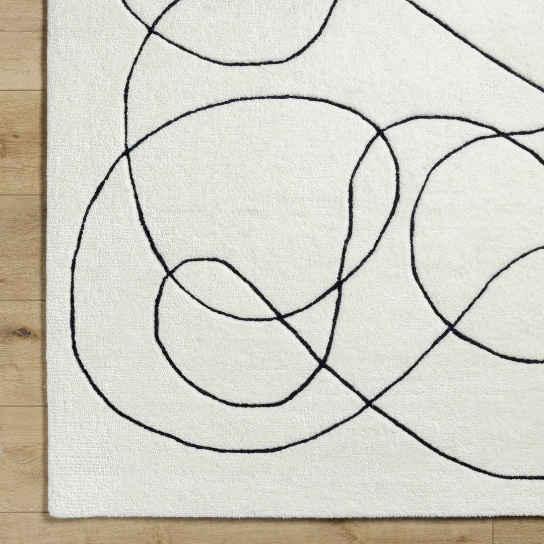 Harta Ivory And Black Contemporary Hand Tufted Wool Area Rug - The Rug Decor