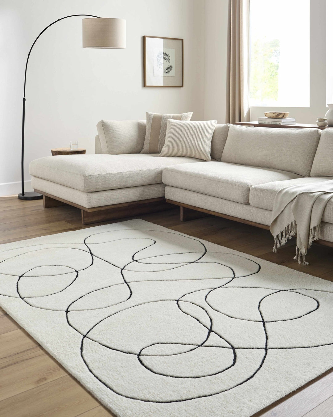 Harta Ivory And Black Contemporary Hand Tufted Wool Area Rug - The Rug Decor