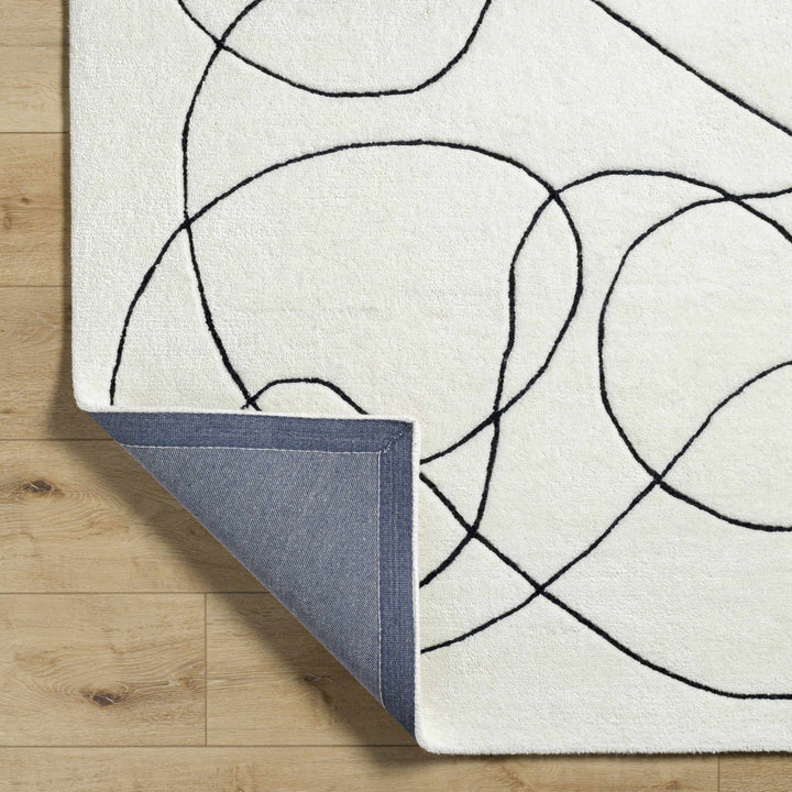 Harta Ivory And Black Contemporary Hand Tufted Wool Area Rug - The Rug Decor