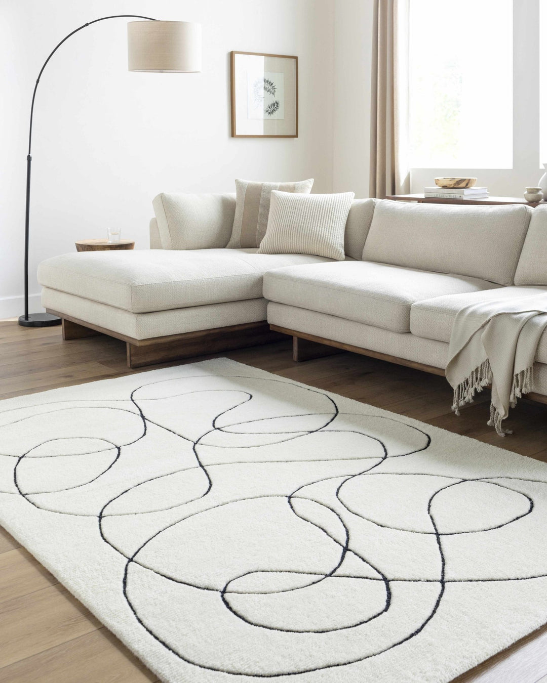Harta Ivory And Black Contemporary Hand Tufted Wool Area Rug - The Rug Decor