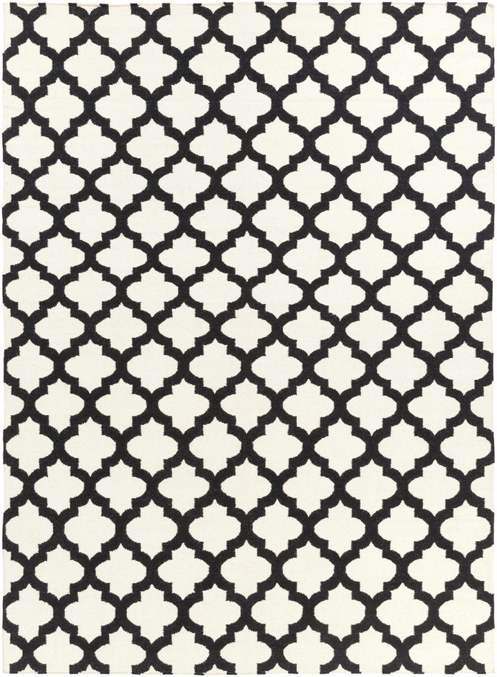 Hand-woven area rug with repeating ivory and black geometric trellis pattern, full view