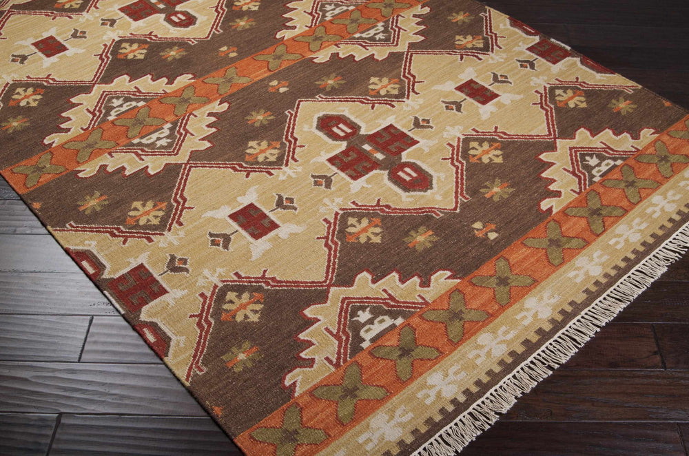 Brown and mustard hand-woven wool rug corner view with geometric diamond pattern