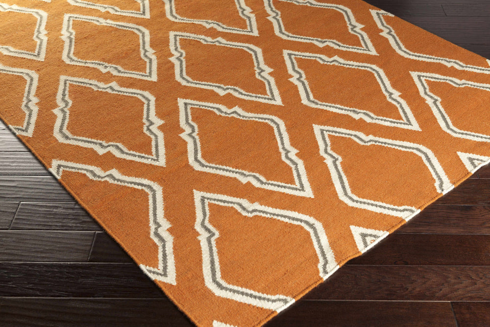 Orange and ivory geometric area rug with diamond lattice pattern, corner view